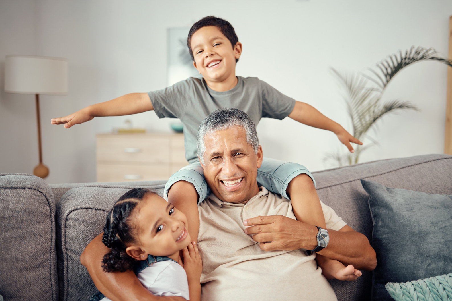 Grandkids, Grandpa and Play Together in Living Room for Love, Care and Relax in  Home. Portrait of Happy Children, Smile Senior Grandparent and Bonding, Laughing and Enjoying Funny Quality Time